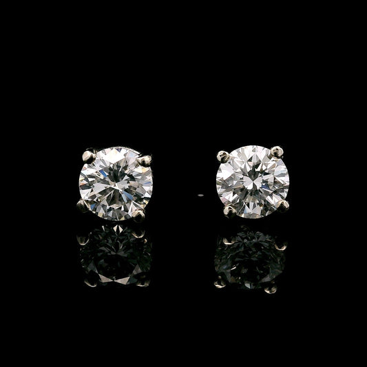 14K White gold stud earrings set with round brilliant diamonds. Item J37874 - ABC Jewelry Co.