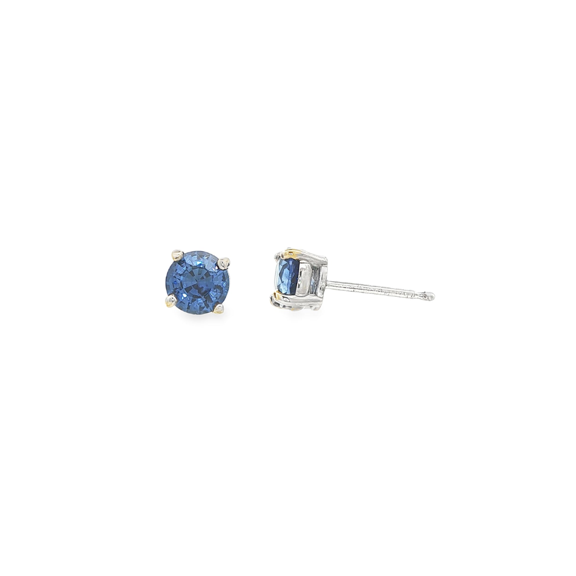 14K White gold stud earrings set with round blue sapphires. Item J37904 - ABC Jewelry