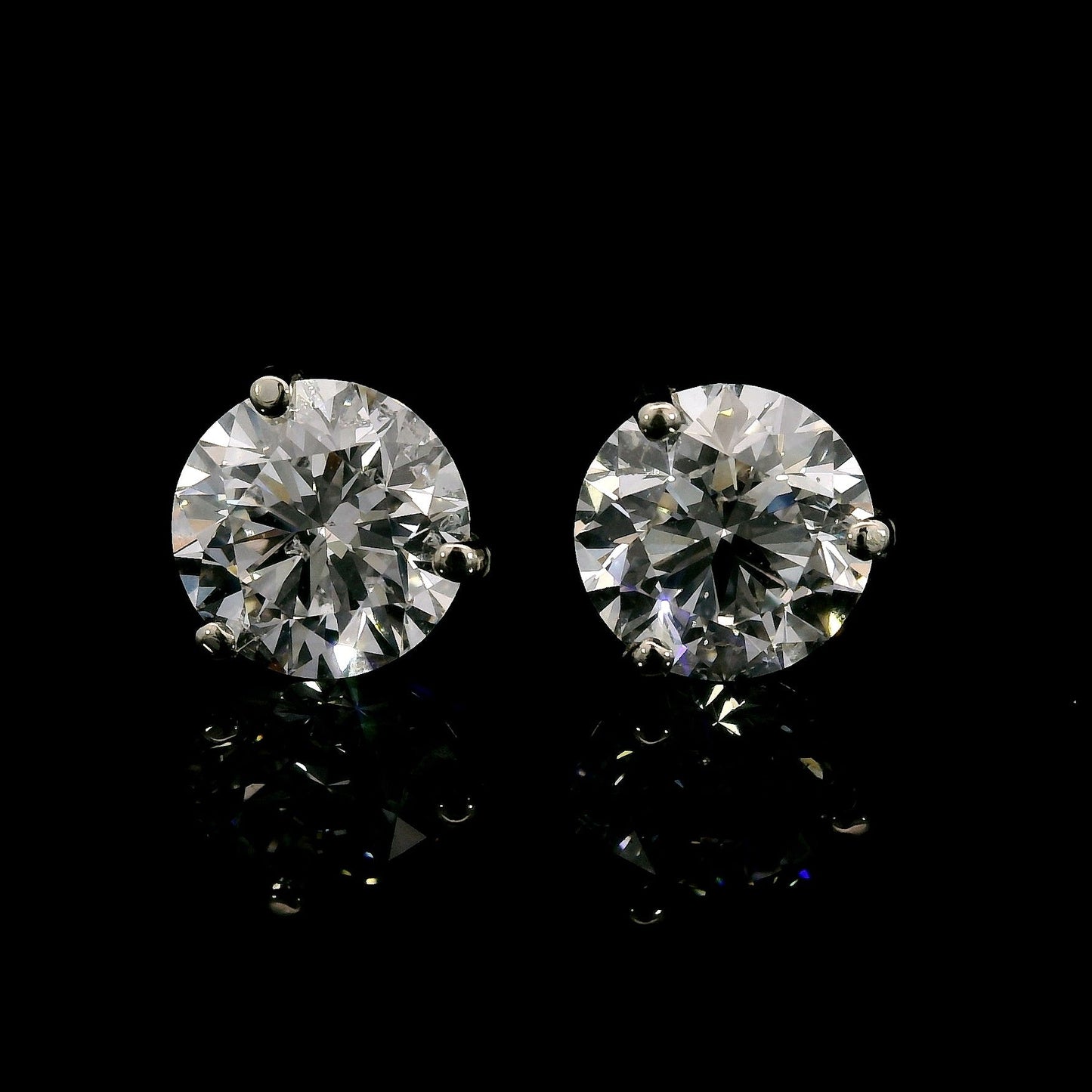 14K White gold studs set with round brilliant diamonds. Item J37908 - ABC Jewelry Co. 