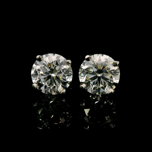 14K White gold studs set with round brilliant diamonds. Item J37909 - ABC Jewelry Co. 