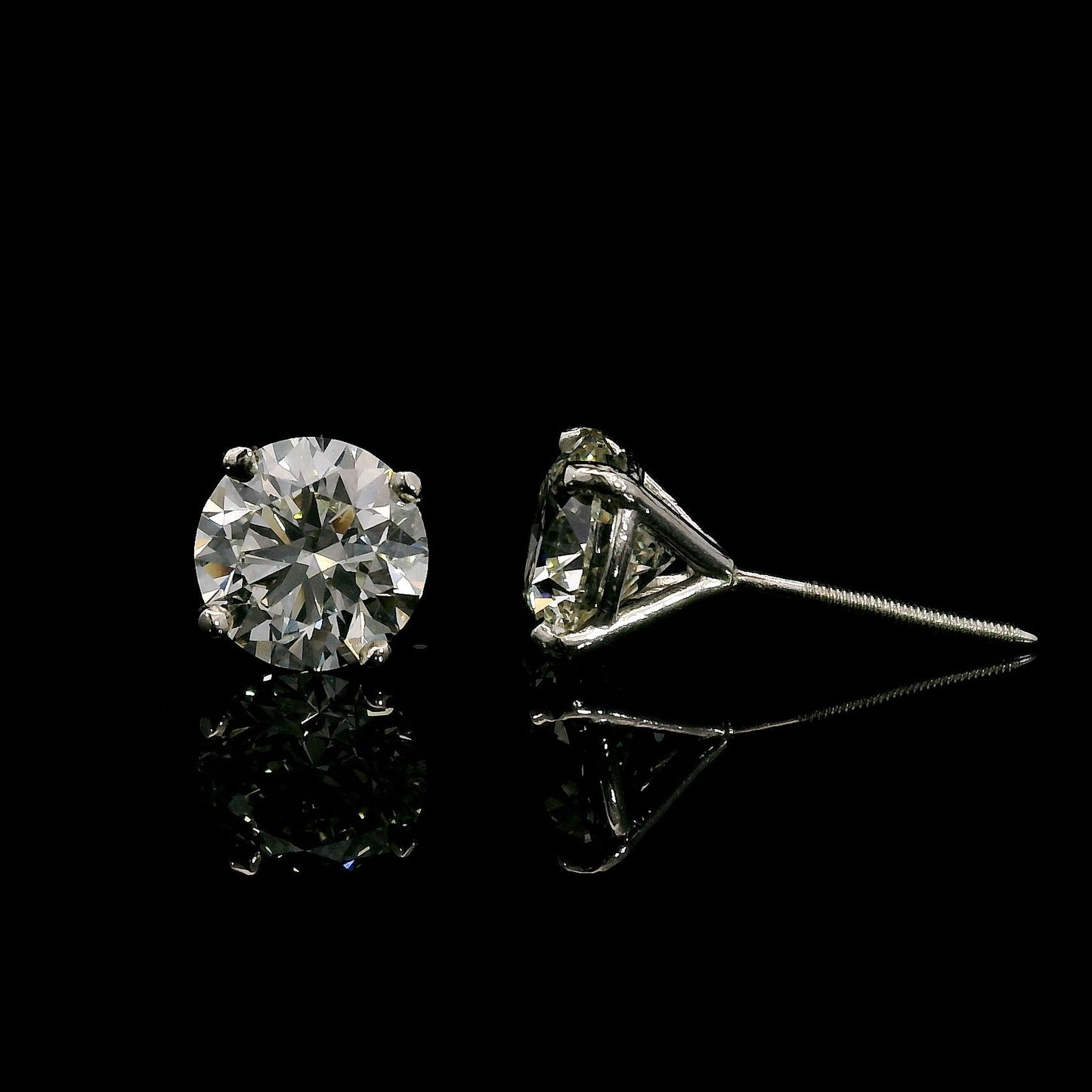 14K White gold studs set with round brilliant diamonds. Item J37909 - ABC Jewelry Co. 