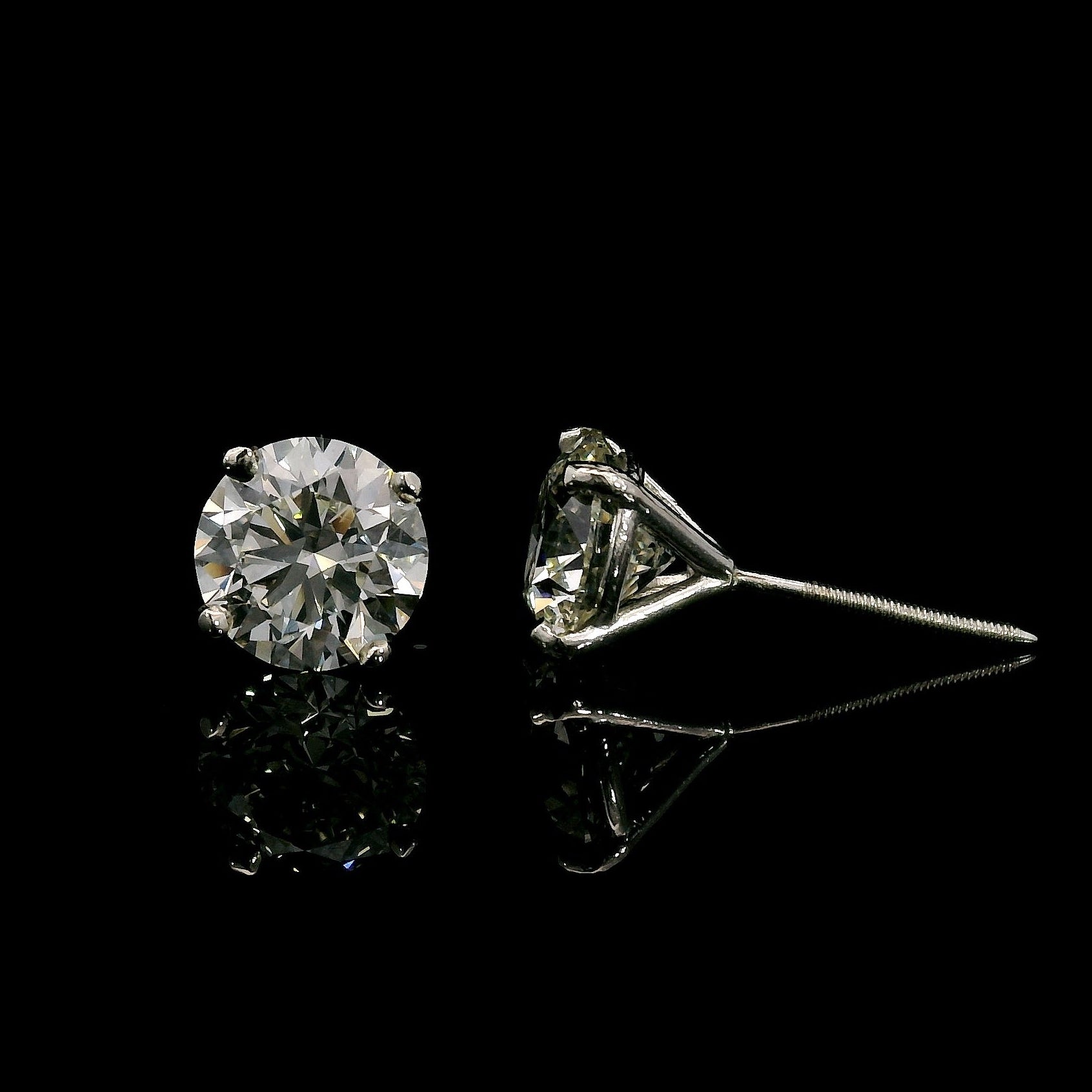 14K White gold studs set with round brilliant diamonds. Item J37909 - ABC Jewelry Co. 
