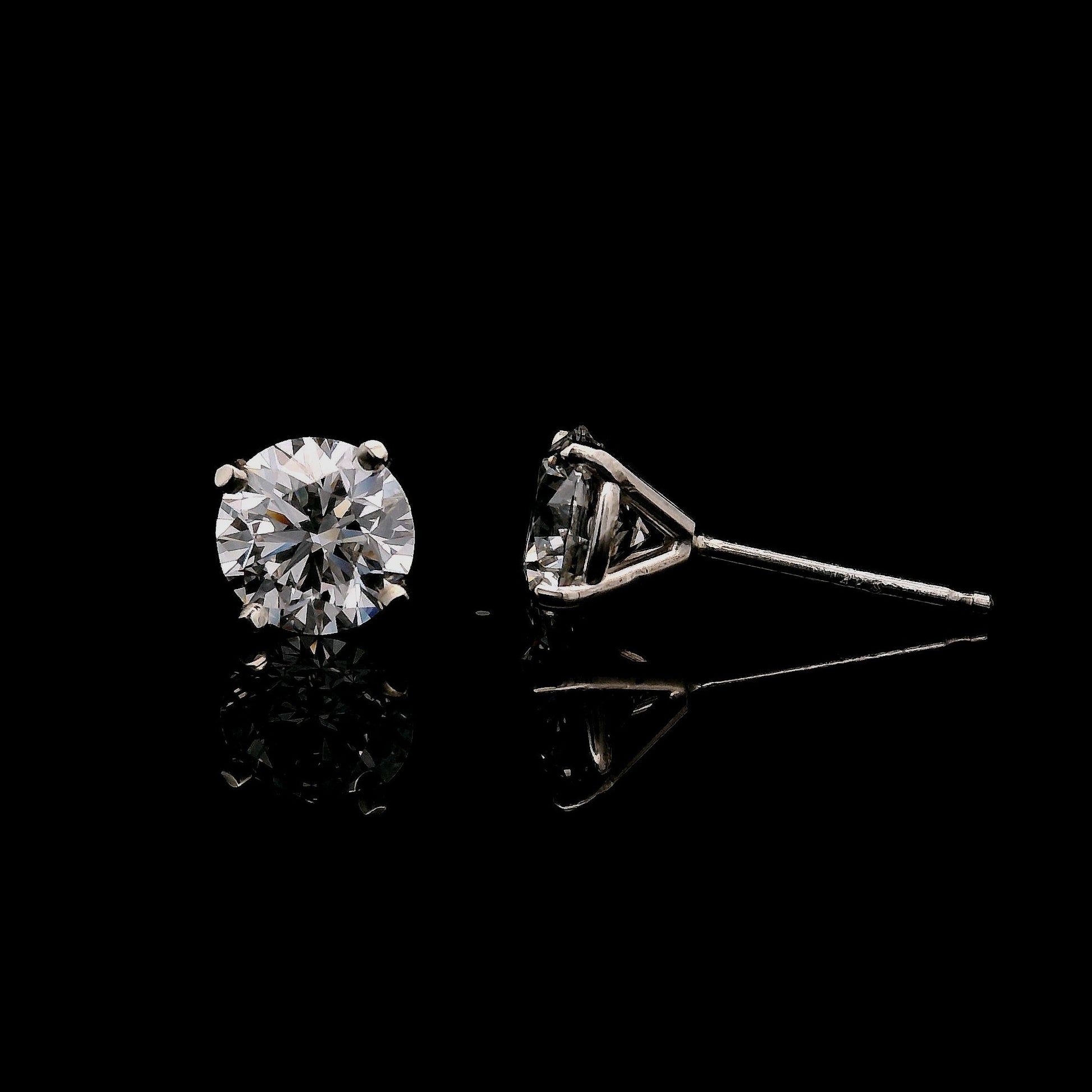 14K White gold stud earrings set with round brilliant diamonds. Item J37948 - ABC Jewelry Co. 