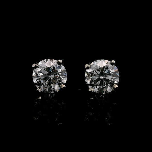 14K White gold stud earrings set with round brilliant diamonds. Item J37948 - ABC Jewelry Co. 