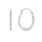 14K White gold oval hoop earrings set with round brilliant diamonds. Item J37963 - ABC Jewelry Co