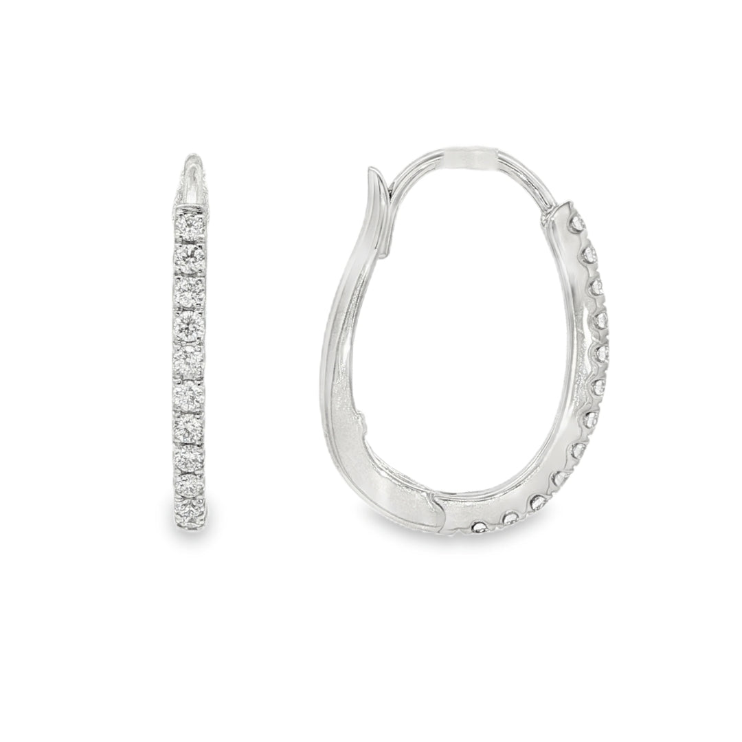14K White gold oval hoop earrings set with round brilliant diamonds. Item J37963 - ABC Jewelry Co
