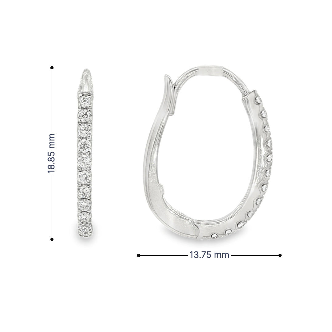 14K White gold oval hoop earrings set with round brilliant diamonds. Item J37963 - ABC Jewelry Co