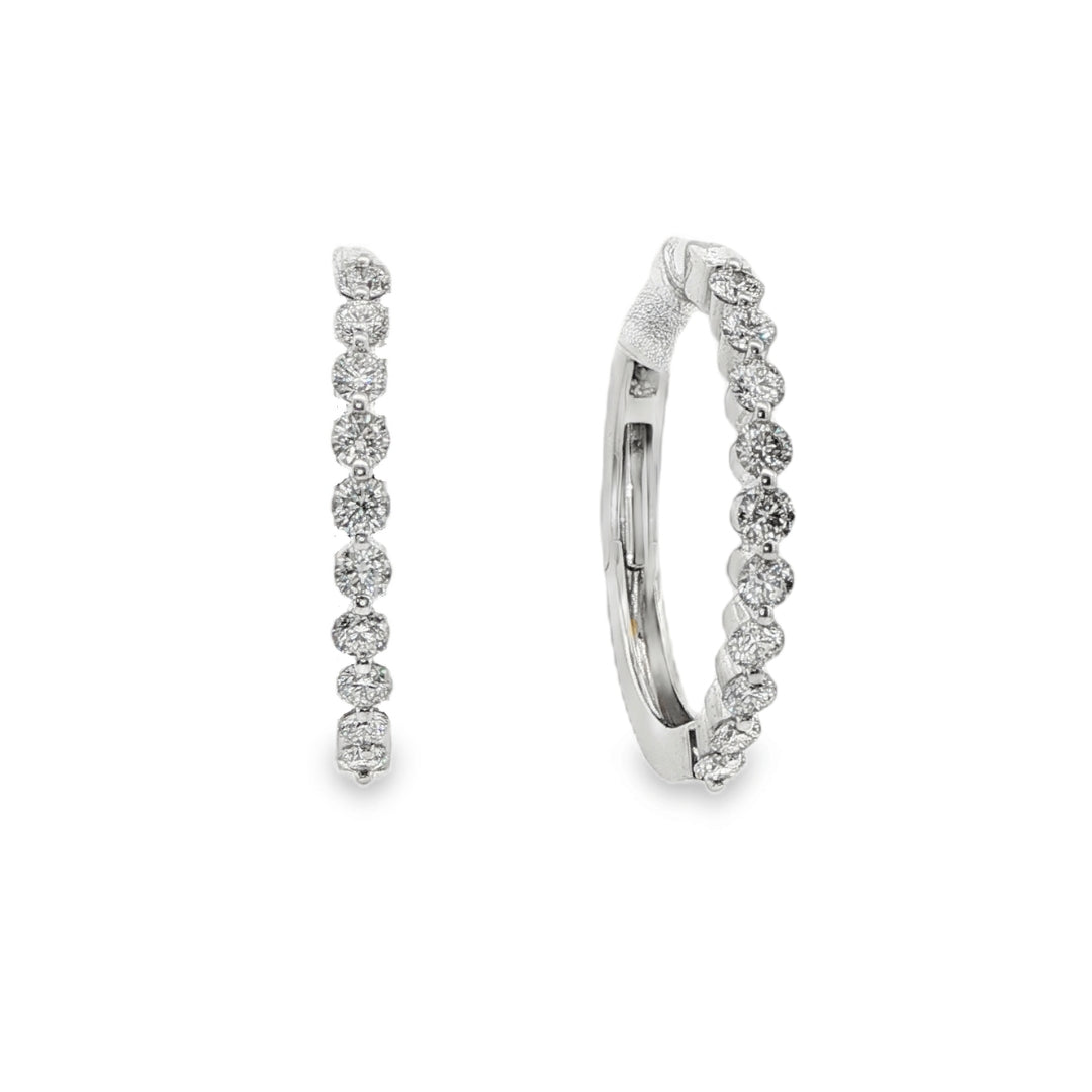 14K White gold hoop earrings set with round brilliant diamonds. Item J37964 - ABC Jewelry Co
