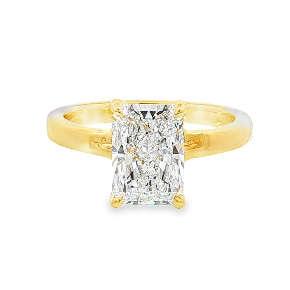 14K Yellow gold solitaire engagement ring set with radiant cut diamond. Item J37991 - ABC Jewelry Co. 
