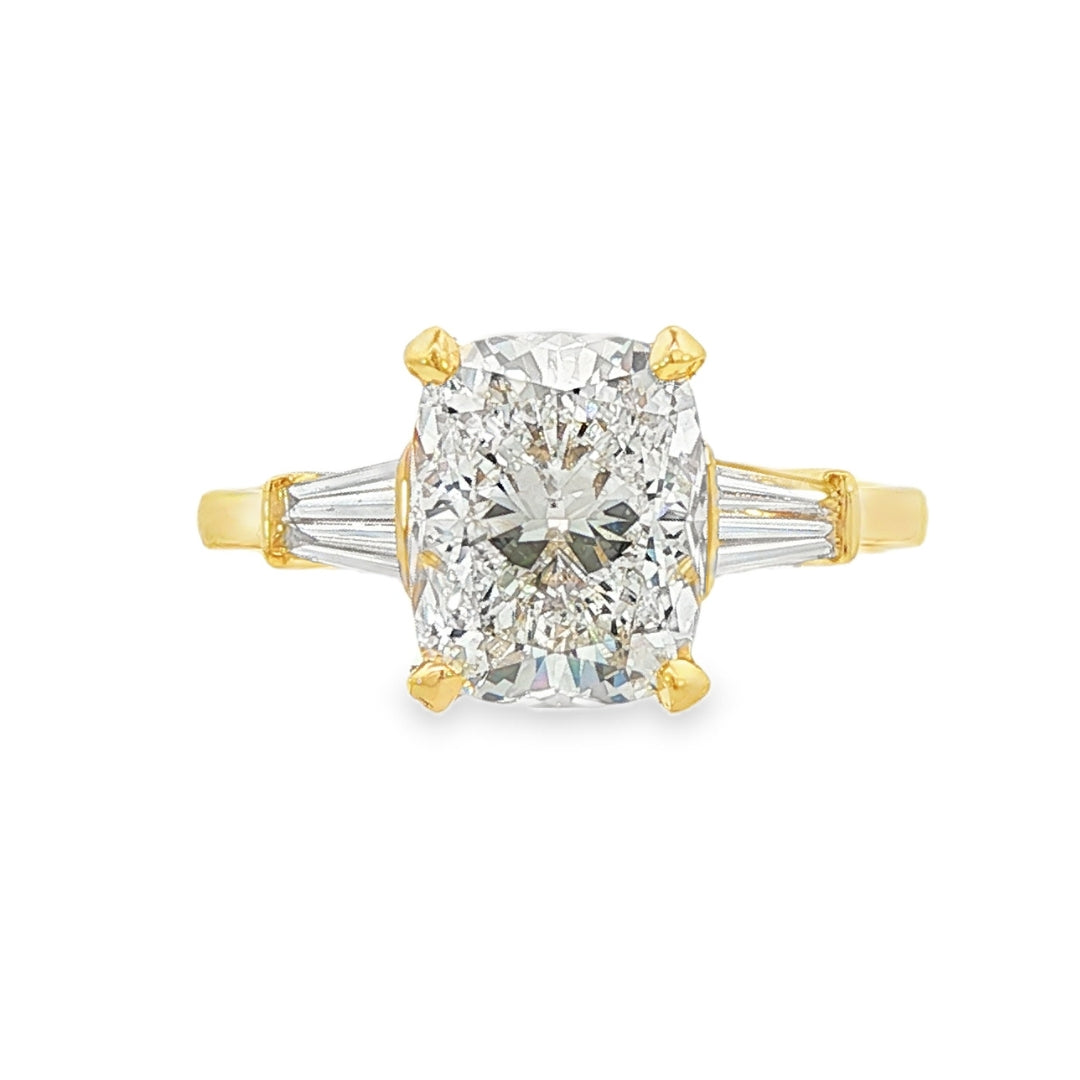 14K Yellow gold engagement ring set with a cushion cut center diamond and accented with 4 tapered baguette diamonds. Item J38008- ABC Jewelry Co. 