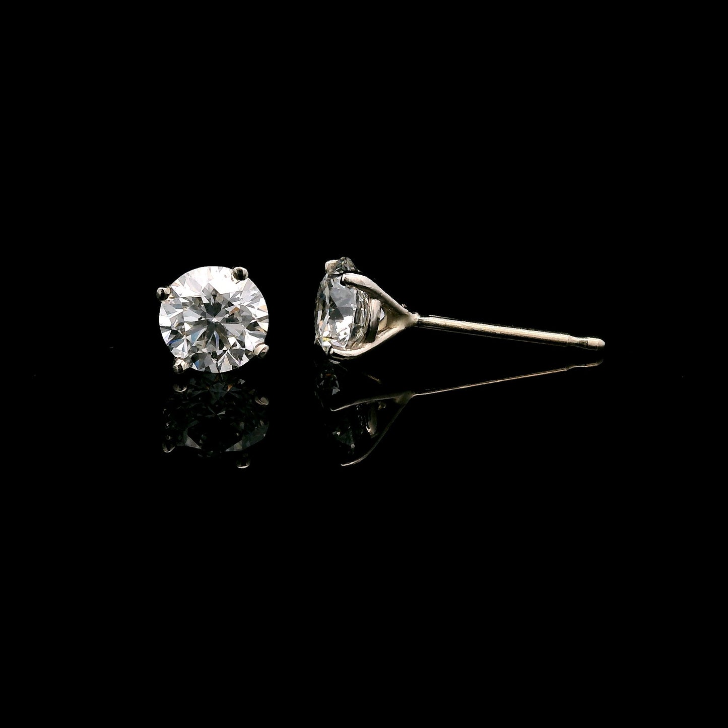 14K White gold diamond stud earrings. Item J38131 - ABC Jewelry Co. 