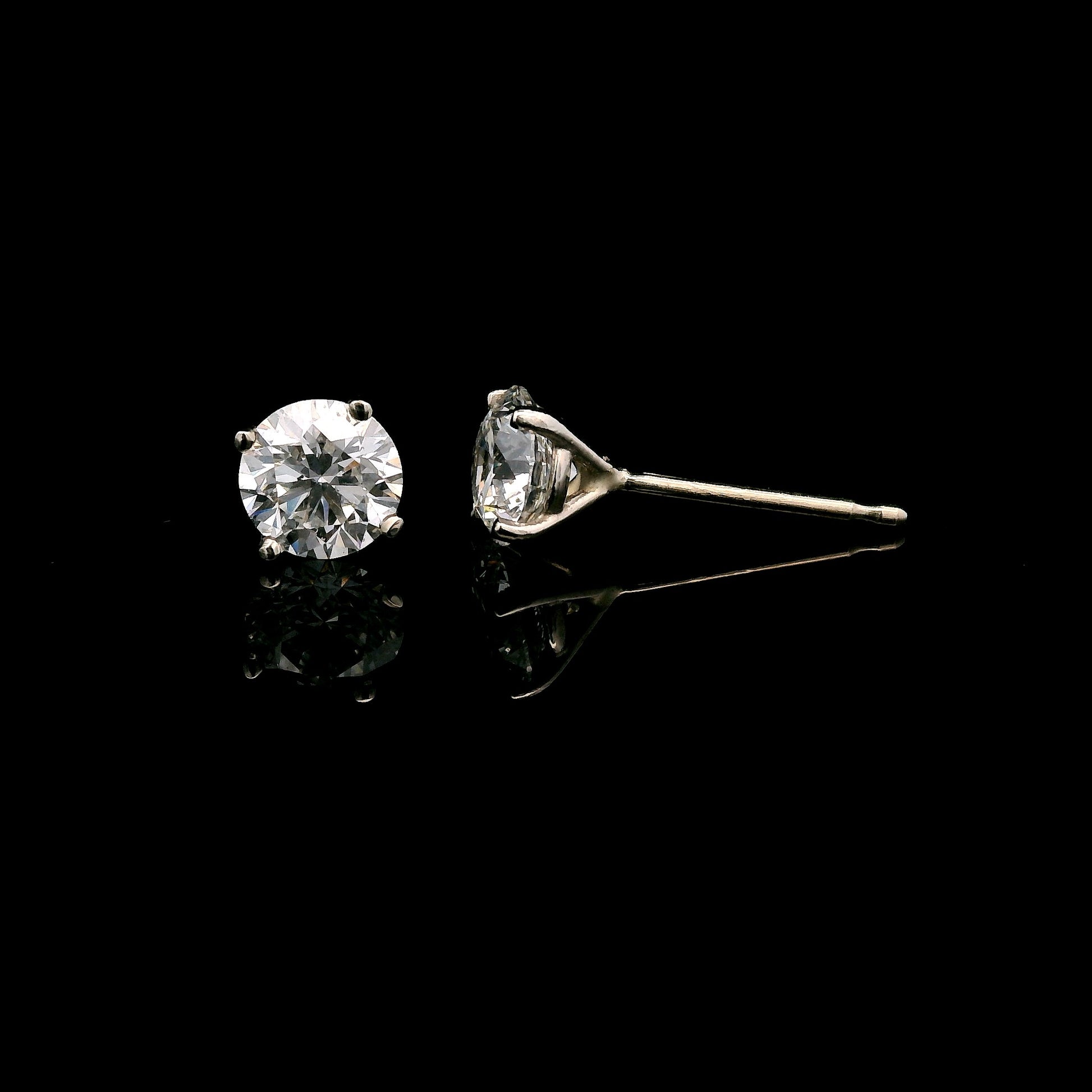 14K White gold diamond stud earrings. Item J38131 - ABC Jewelry Co. 