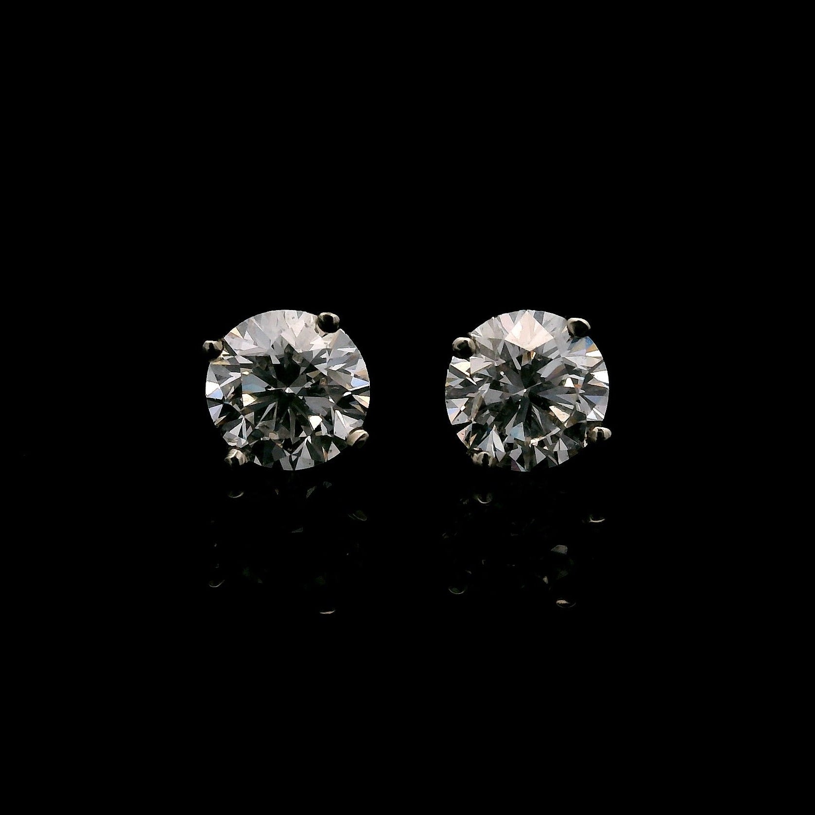 14K White gold diamond stud earrings. Item J38131 - ABC Jewelry Co. 