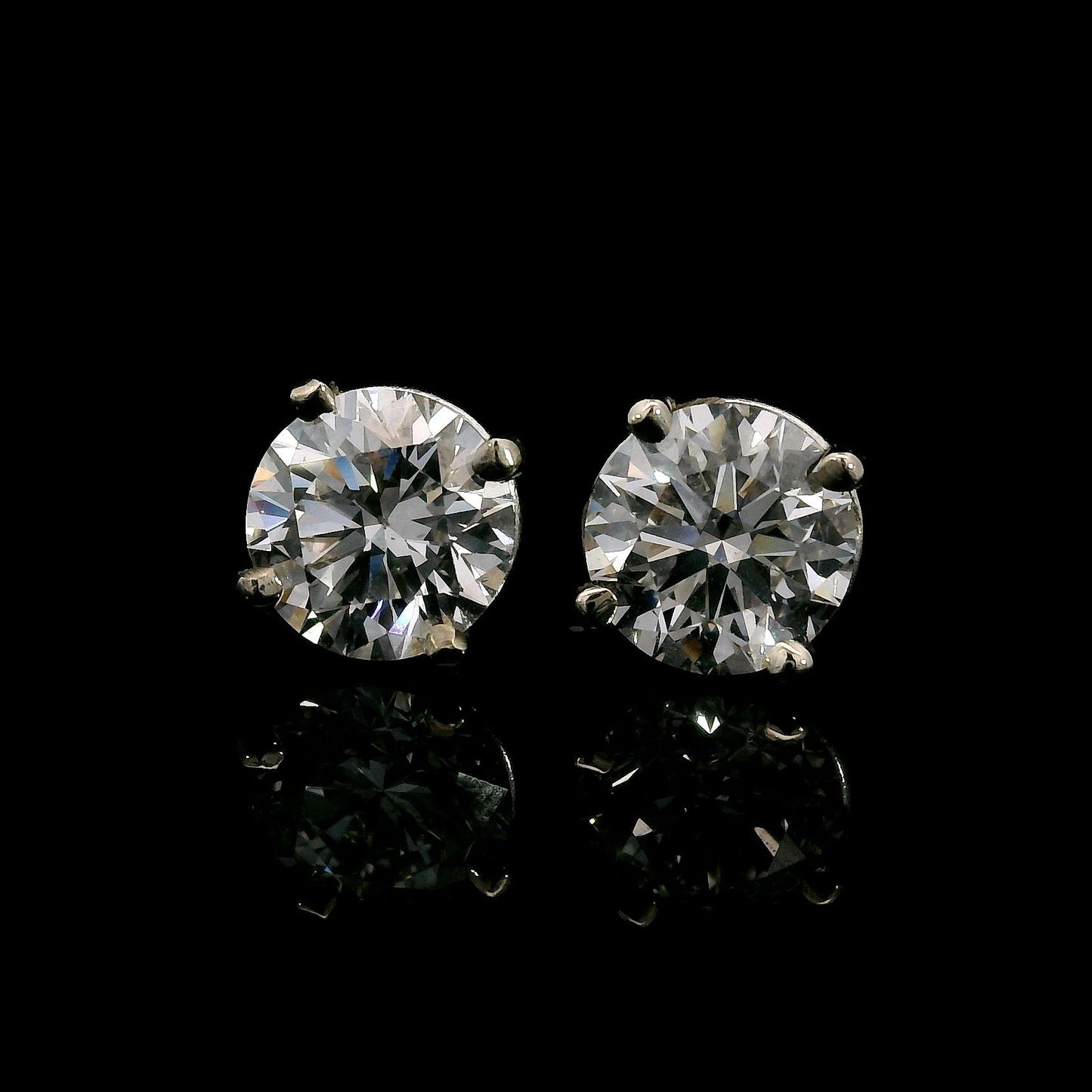 14K White gold studs set with round brilliant diamonds. Item J38143 - ABC Jewelry Co. 