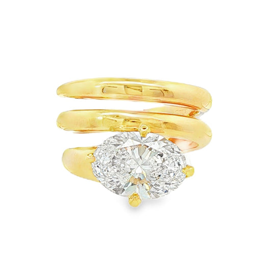 14K Yellow gold spiral ring set with large oval diamond. Item J38577 - ABC Jewelry Co. 