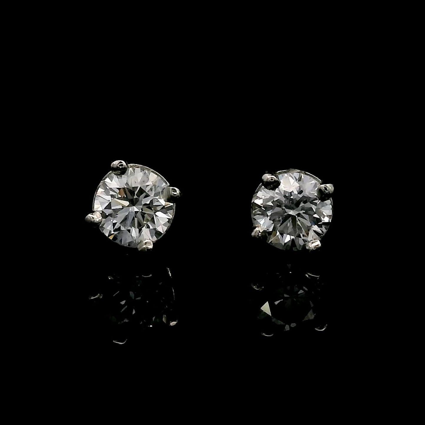 14K White gold stud earrings set with round brilliant diamonds. Item J38637 - ABC Jewelry Co. 