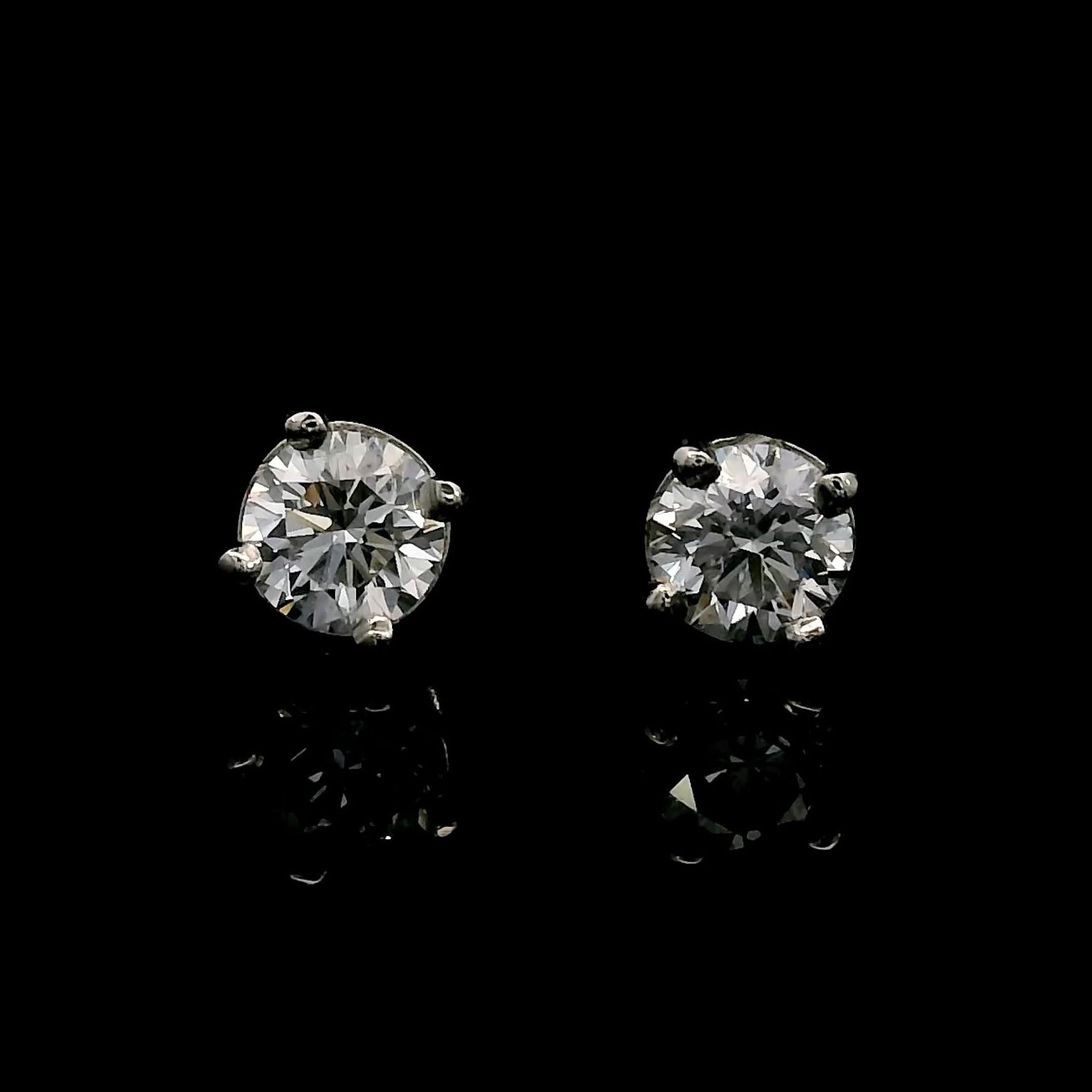 14K White gold stud earrings set with round brilliant diamonds. Item J38637 - ABC Jewelry Co. 
