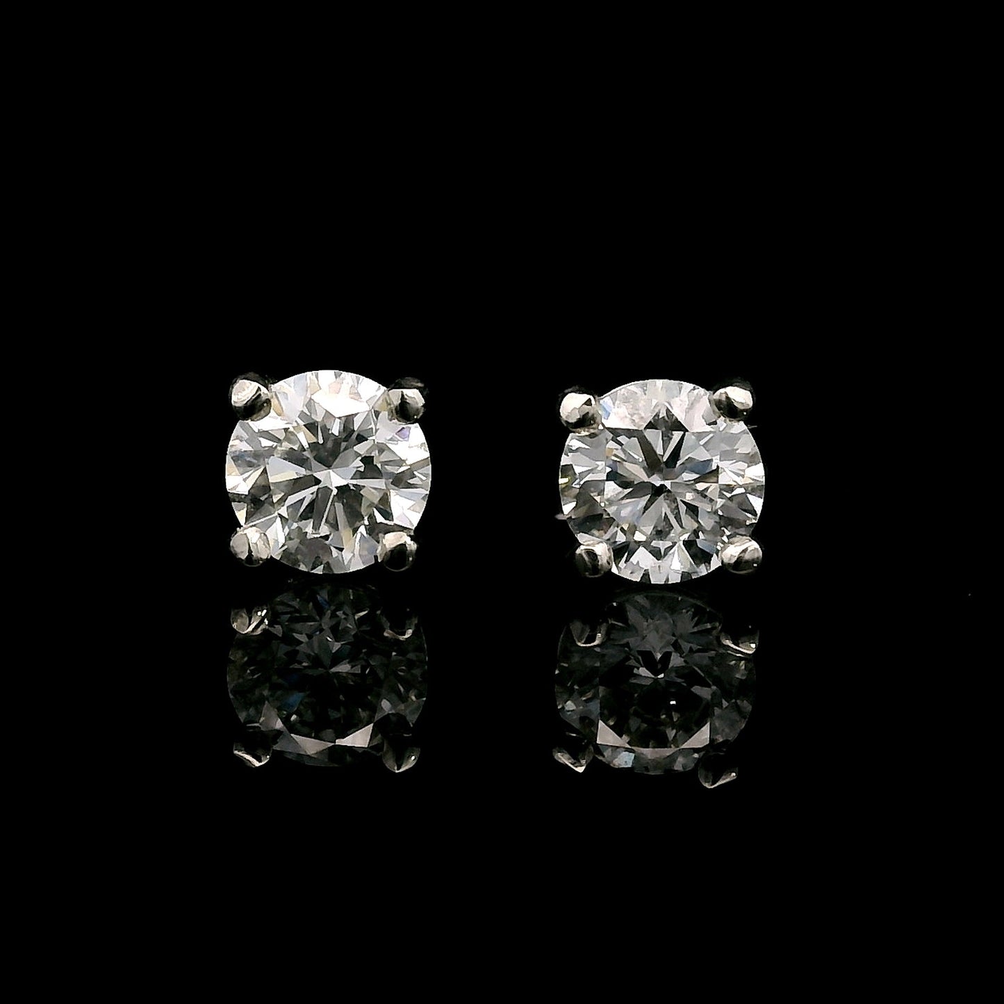 14K White gold stud earrings set with round brilliant diamonds. Item J38639 - ABC Jewelry Co. 