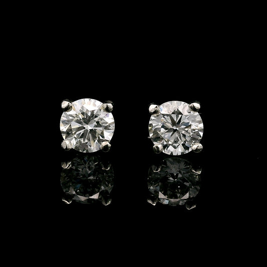 14K White gold stud earrings set with round brilliant diamonds. Item J38639 - ABC Jewelry Co. 
