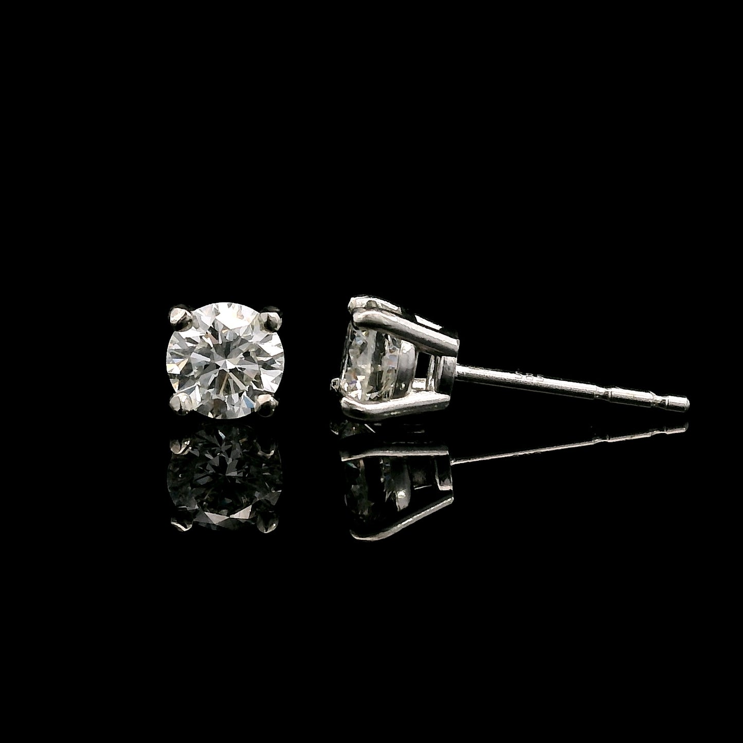 14K White gold stud earrings set with round brilliant diamonds. Item J37987 - ABC Jewelry Co. 