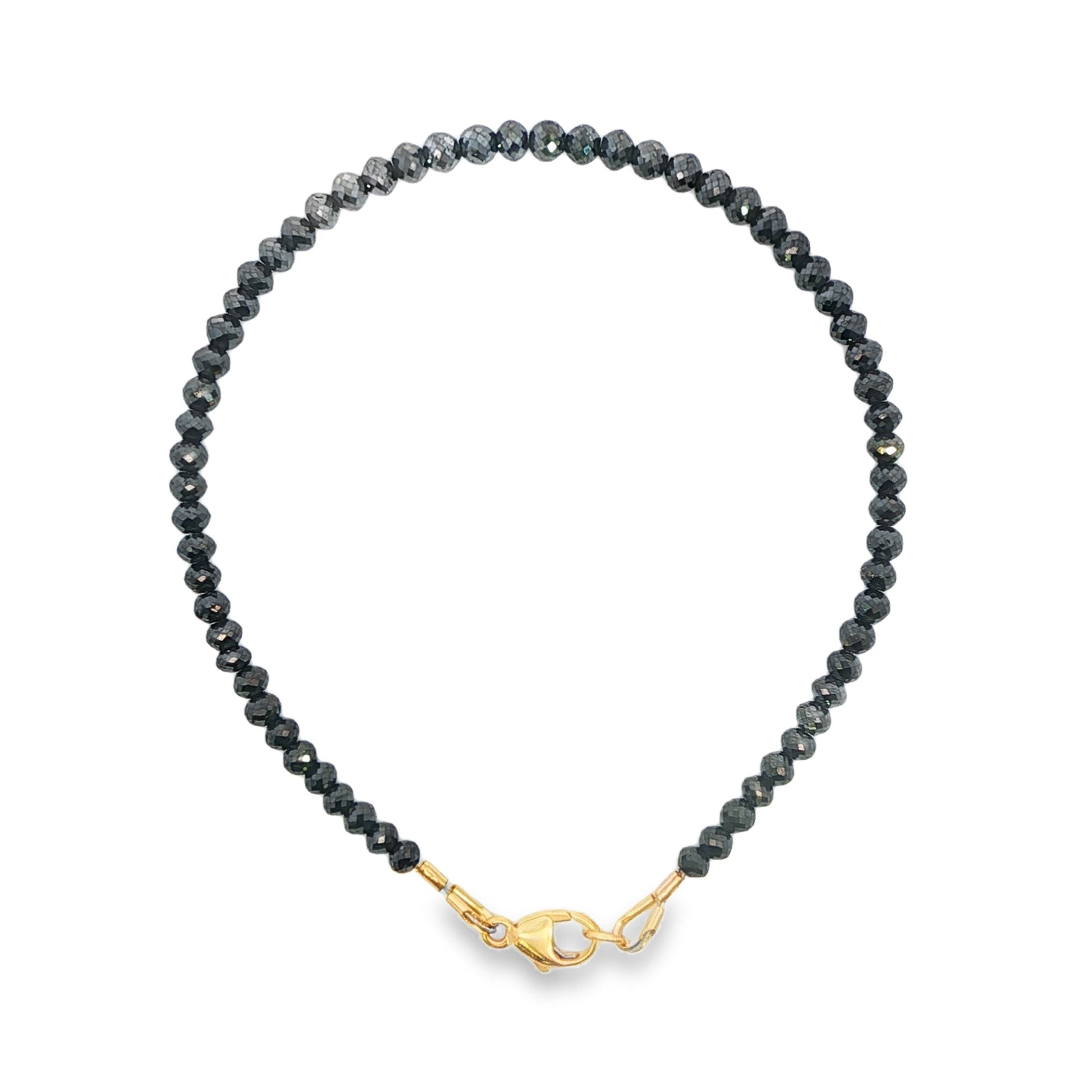 Black diamond strand bracelet with 14K yellow gold clasp. Item J38679 - ABC Jewelry Co.