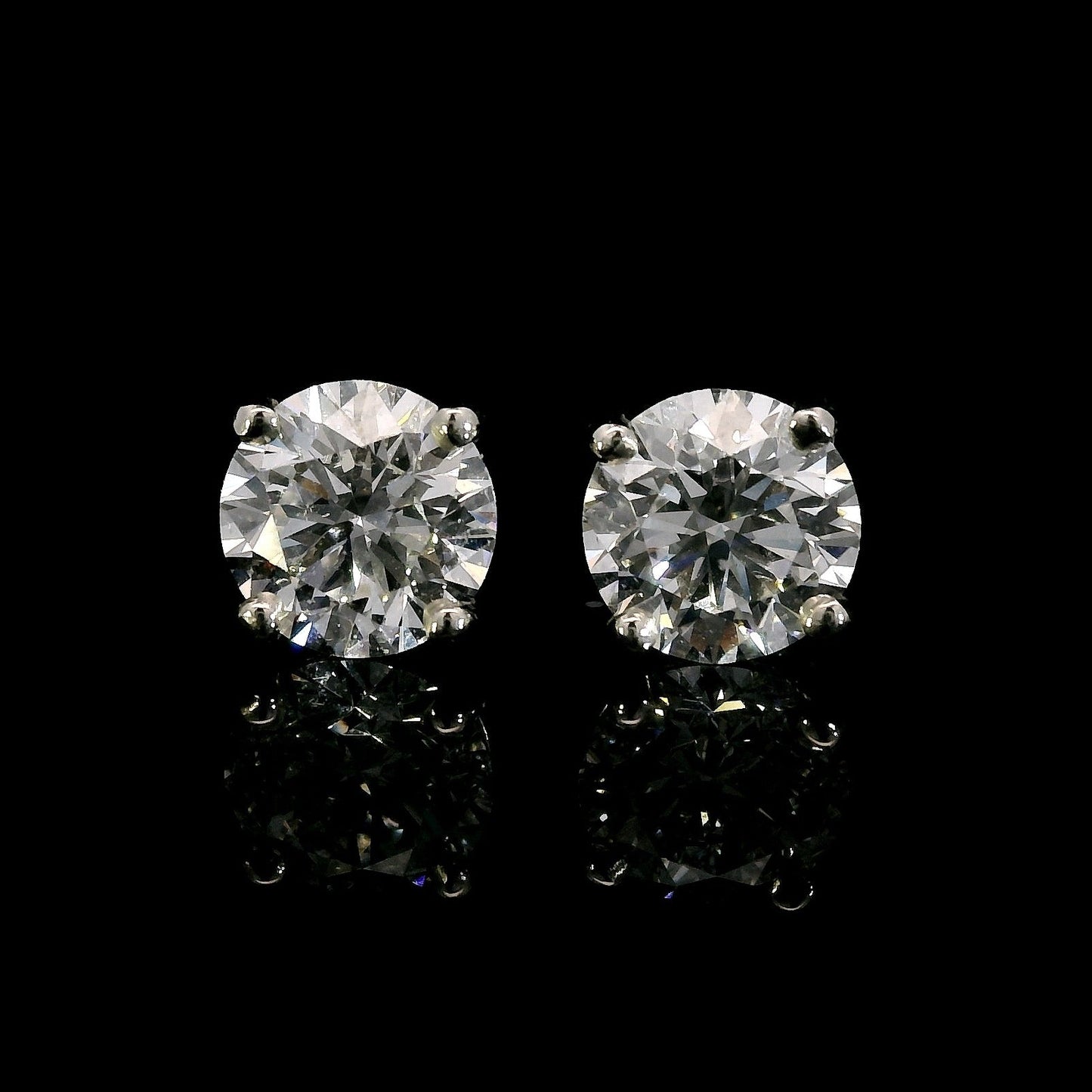 14K White gold studs set with round brilliant diamonds. Item J38704 - ABC Jewelry Co. 