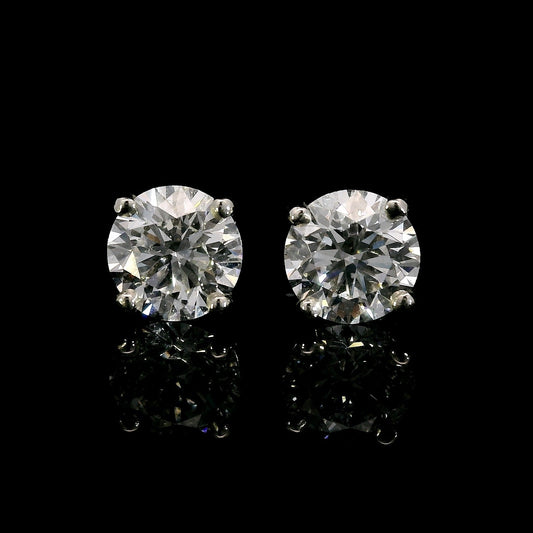 14K White gold studs set with round brilliant diamonds. Item J38704 - ABC Jewelry Co. 