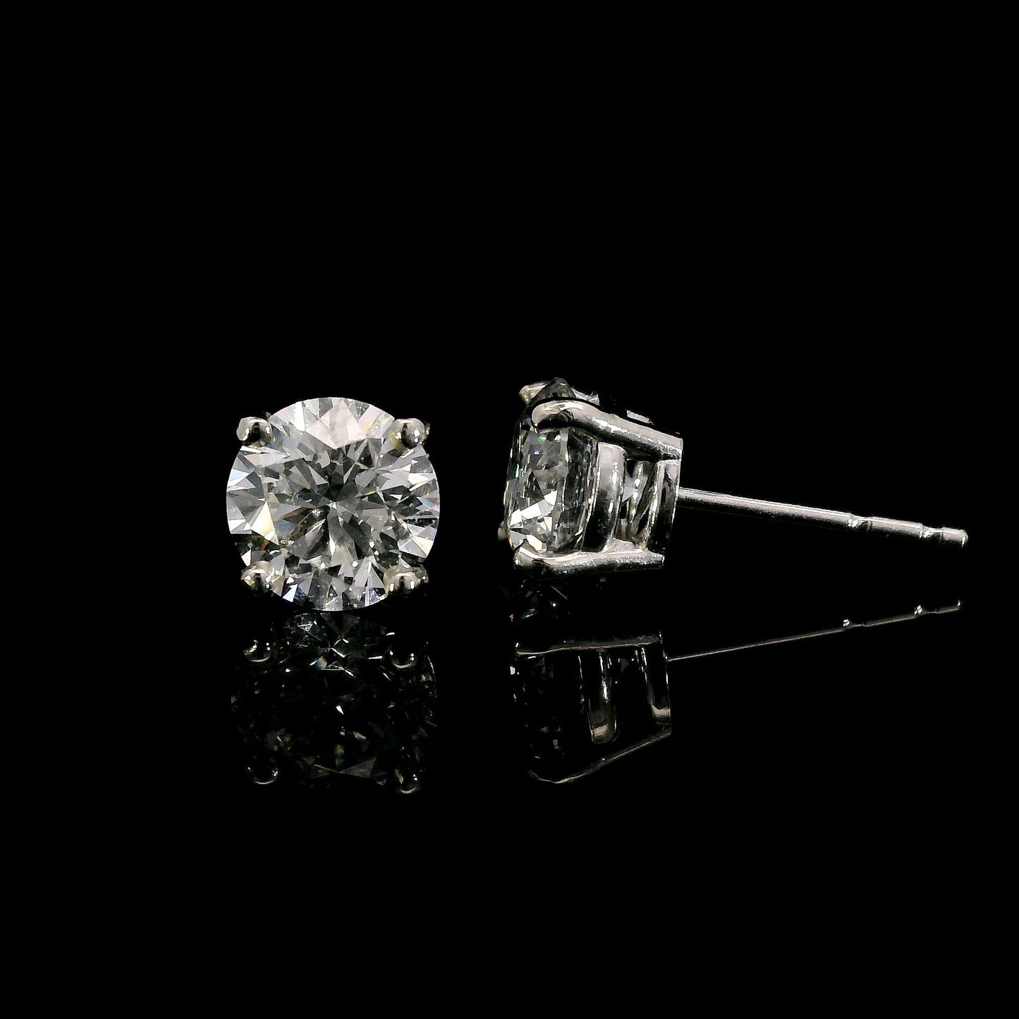 14K White gold studs set with round brilliant diamonds. Item J37908 - ABC Jewelry Co. 