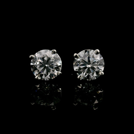 14K White gold studs set with round brilliant diamonds. Item J38705 - ABC Jewelry Co. 