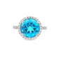 14K White gold ring with a round blue topaz and diamond halo. Item J38755 - ABC Jewelry Co. 