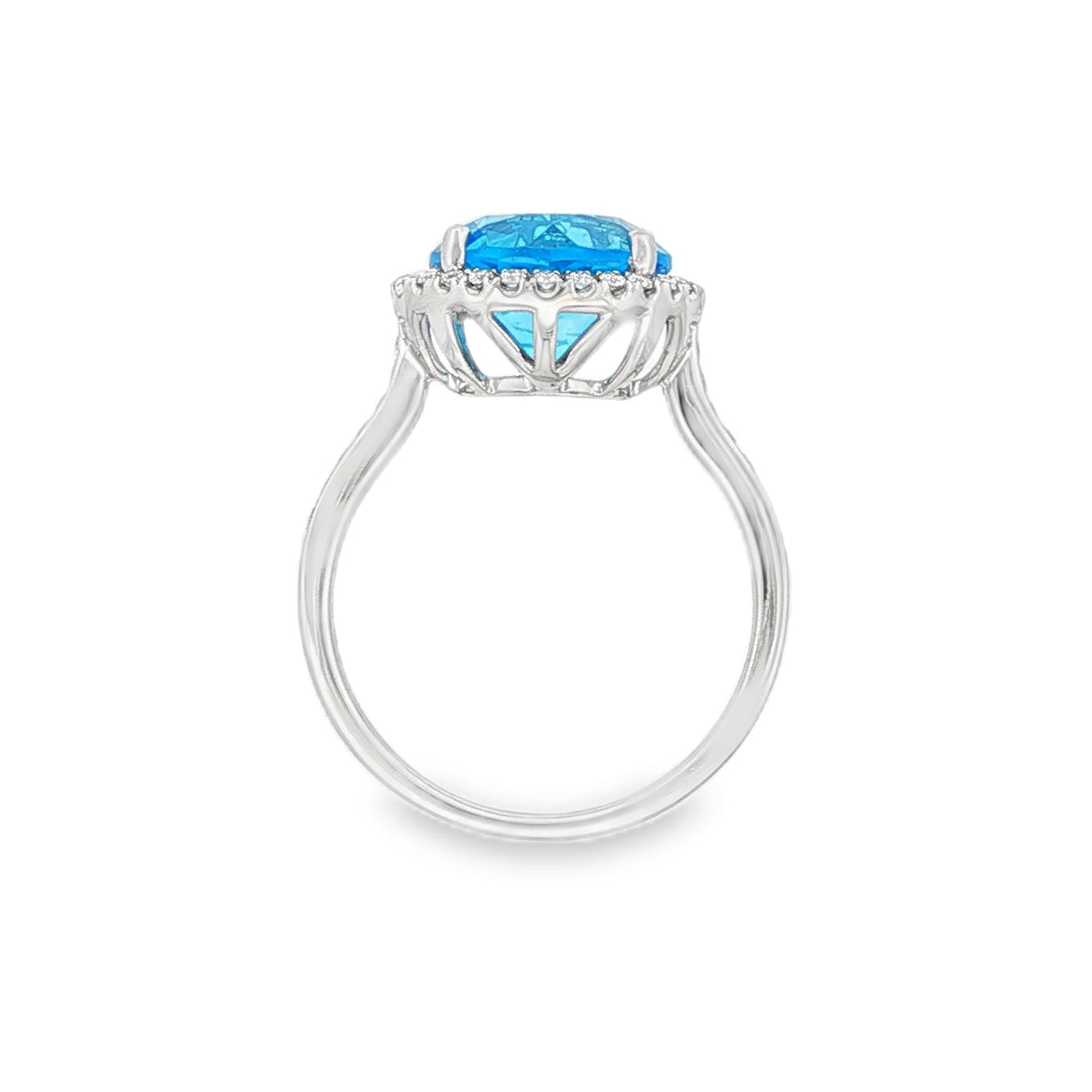 14K White gold ring with a round blue topaz and diamond halo. Item J38755 - ABC Jewelry Co. 