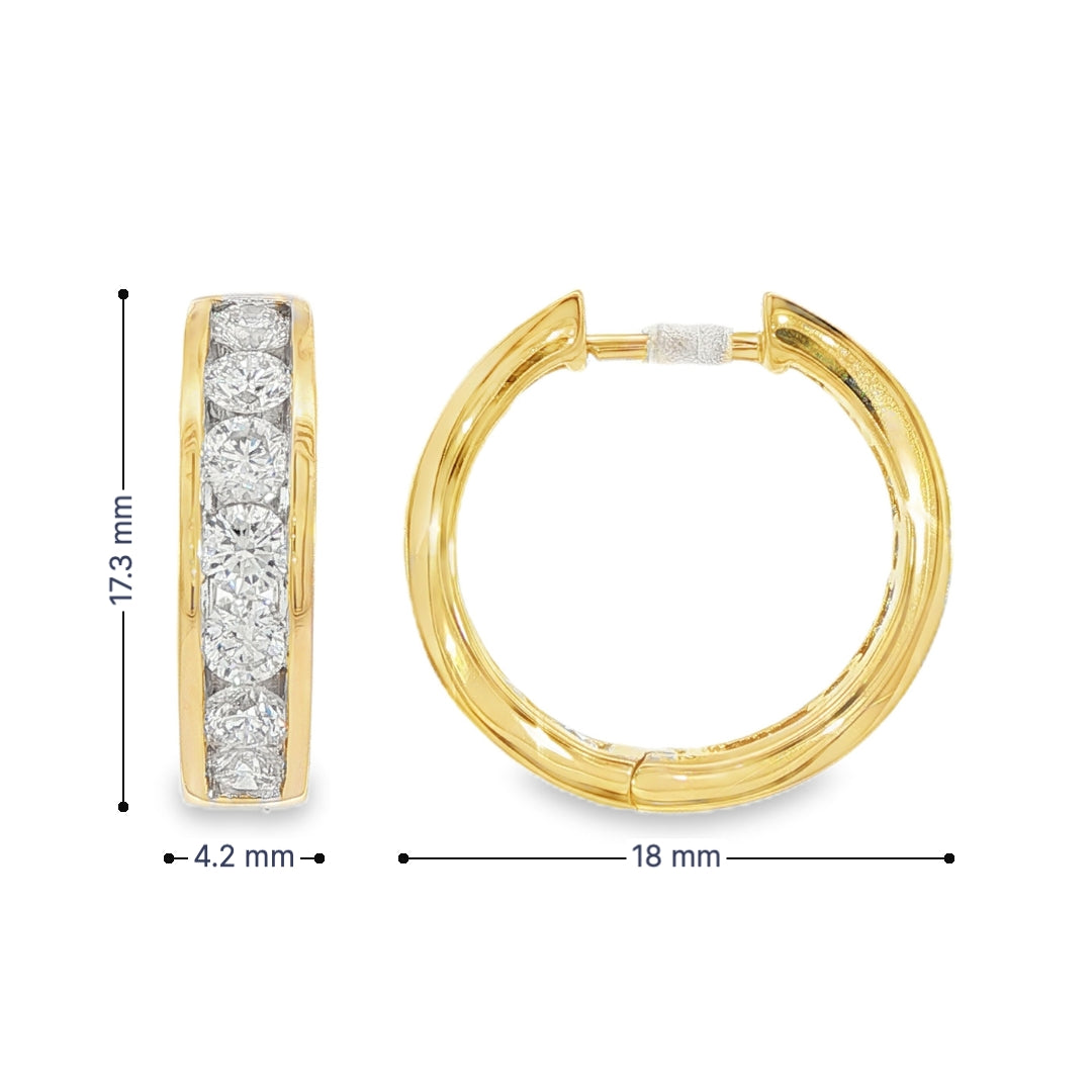 14K Yellow gold hoop earrings channel set with round brilliant diamonds. Item J38756 - ABC Jewelry Co.