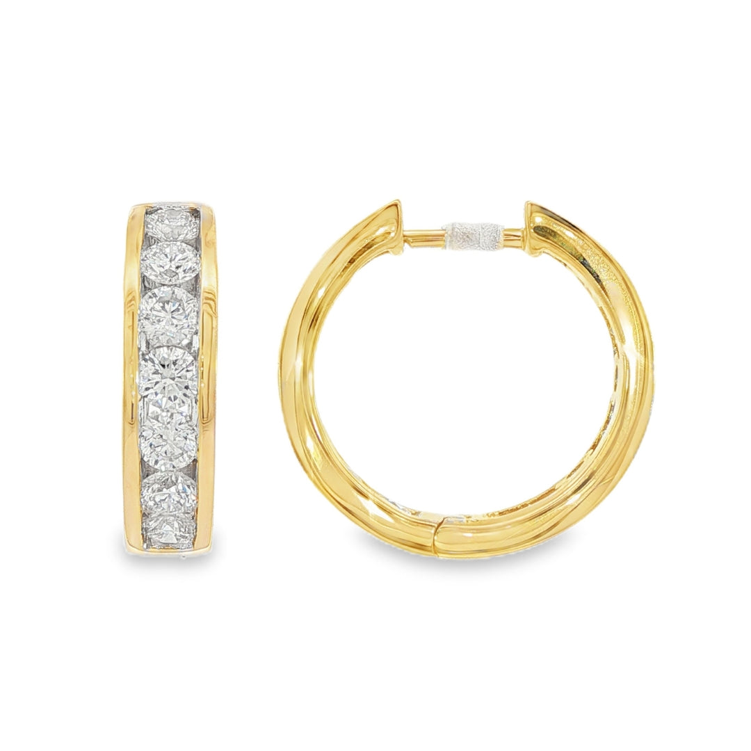 14K Yellow gold hoop earrings channel set with round brilliant diamonds. Item J38756 - ABC Jewelry Co.