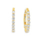 14K Yellow gold oval hoop earrings set with round brilliant diamonds. Item J38766 - ABC Jewelry Co.