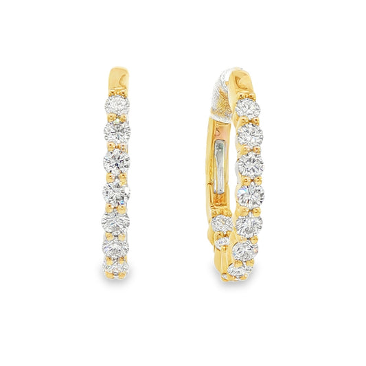 14K Yellow gold oval hoop earrings set with round brilliant diamonds. Item J38766 - ABC Jewelry Co.