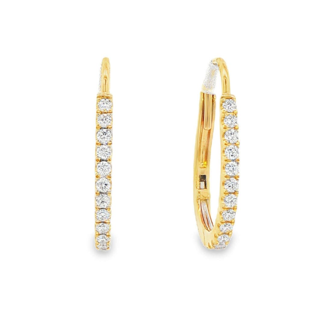 14K Yellow gold oval hoop earrings set with round brilliant diamonds. Item J38769 - ABC Jewelry Co.
