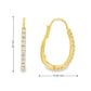 14K Yellow gold oval hoop earrings set with round brilliant diamonds. Item J38769 - ABC Jewelry Co.