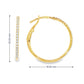 14K Yellow gold hoop earrings set with round brilliant diamonds. Item J38771 - ABC Jewelry Co