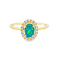 14K Yellow gold ring set with an oval shape opal center stone surrounded by a diamond halo. Item J38784 - ABC Jewelry Co. 
