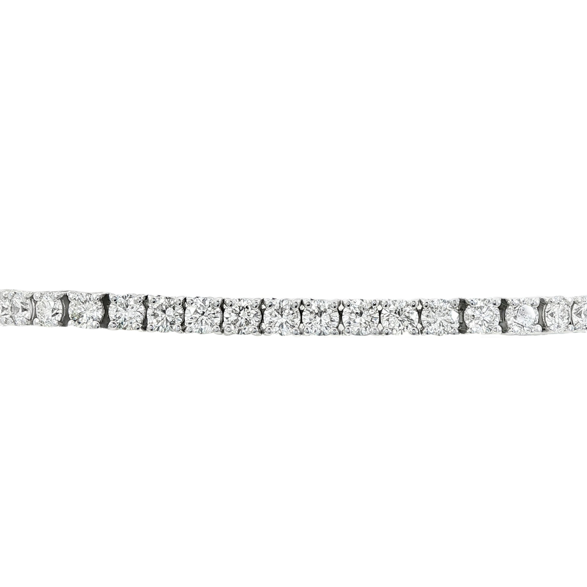 14K White gold tennis bracelet set with round brilliant diamonds. Item J38810 - ABC Jewelry Co