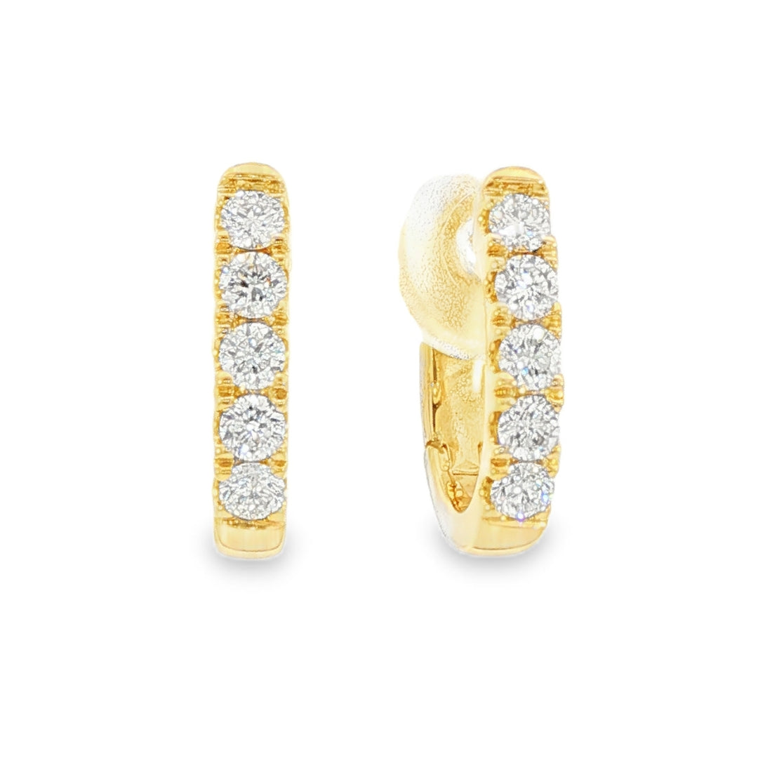 18K Yellow gold diamond set oval huggies. Item J38842 - ABC Jewelry Co.