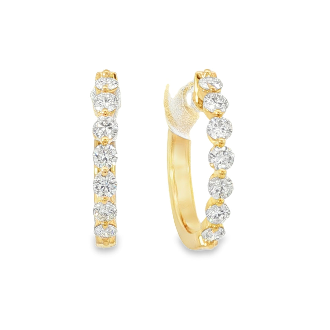 18K Yellow gold hoop earrings set with round brilliant diamonds. Item J38844 - ABC Jewelry Co.
