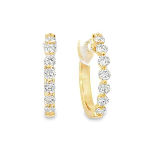 18K Yellow gold hoop earrings set with round brilliant diamonds. Item J38844 - ABC Jewelry Co.
