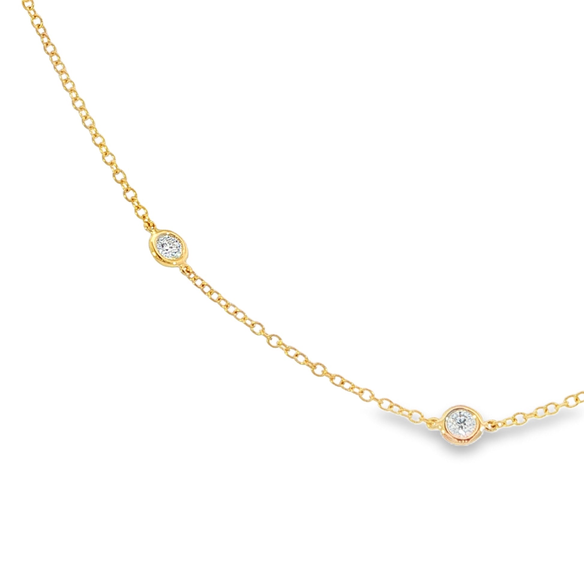 18K Yellow gold necklace with bezel set round brilliant diamonds set along the chain. Item J38856 - ABC Jewelry Co. 