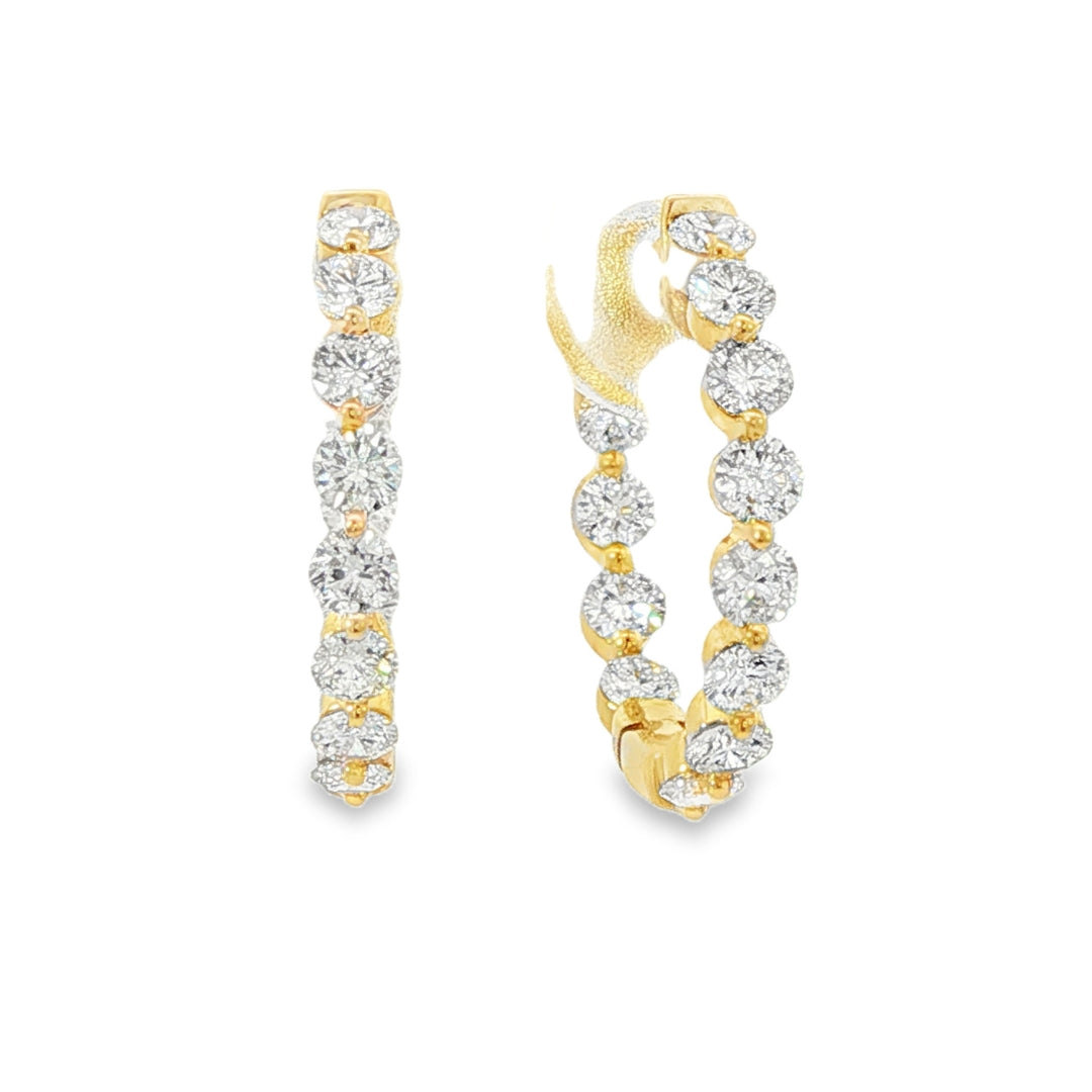 18K Yellow gold hoop earrings set with round brilliant diamonds. Item J38919 - ABC Jewelry Co.