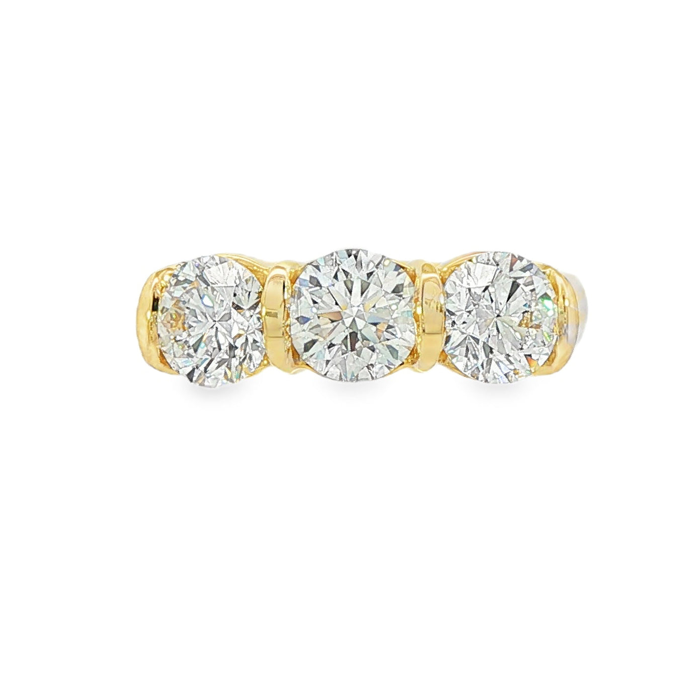 14K Yellow gold ring set with 3 round brilliant diamonds. Item J38945 - ABC Jewelry Co. 