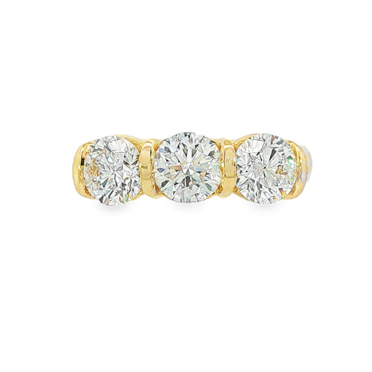 14K Yellow gold ring set with 3 round brilliant diamonds. Item J38945 - ABC Jewelry Co. 