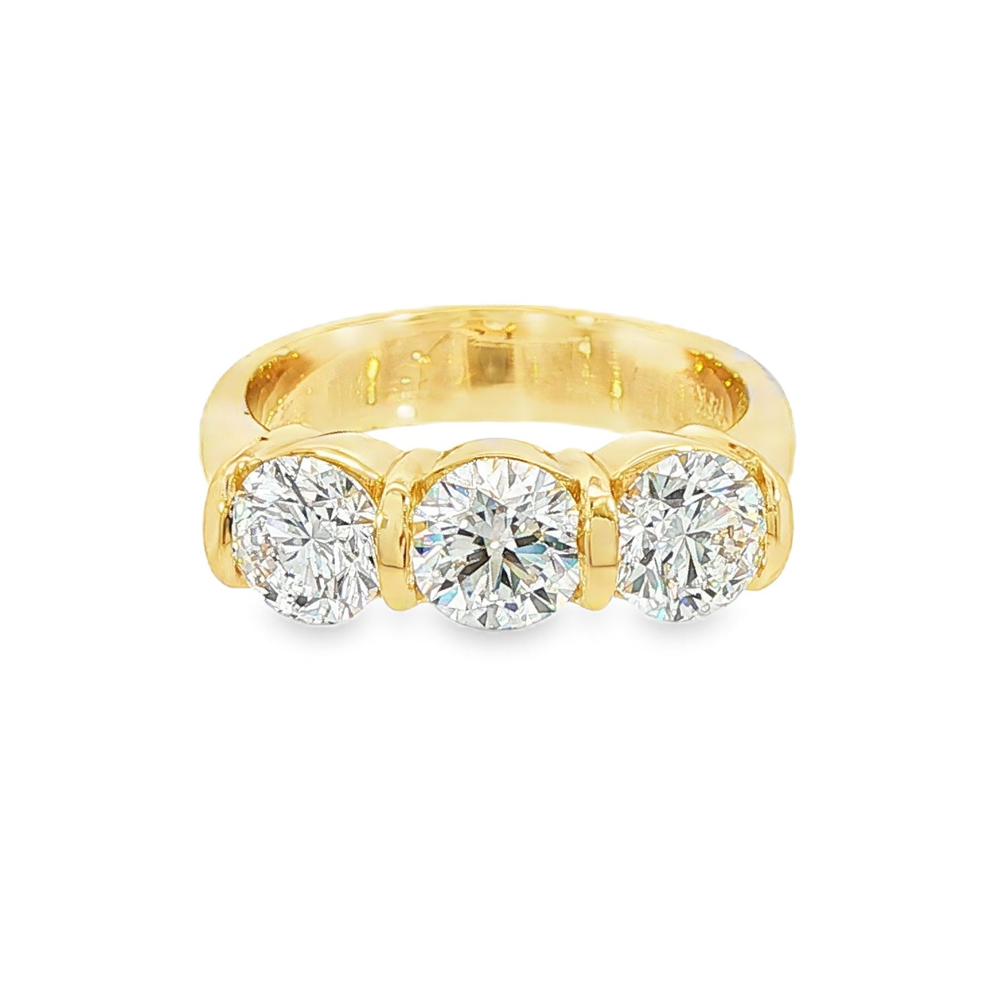 14K Yellow gold ring set with 3 round brilliant diamonds. Item J38945 - ABC Jewelry Co. 