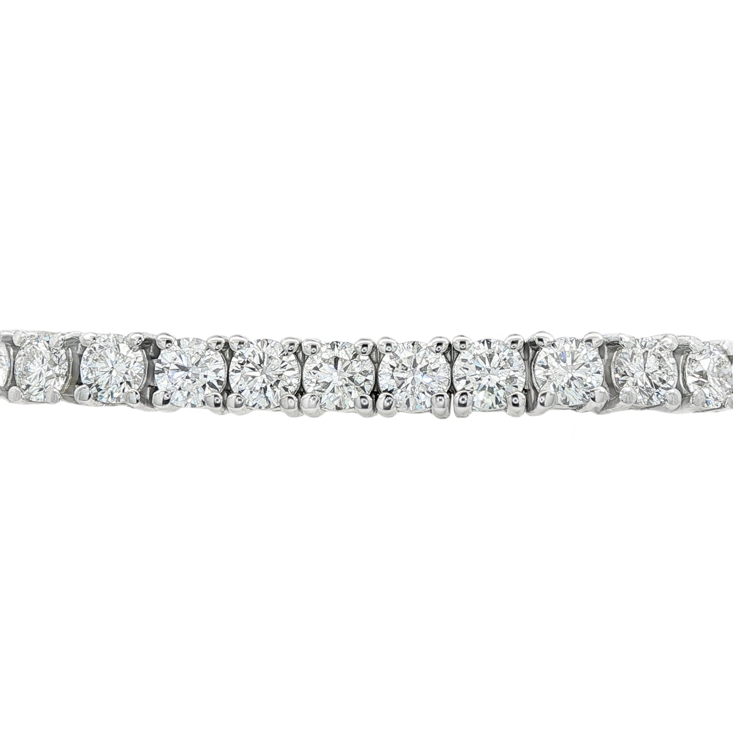 14K White gold tennis bracelet set with round brilliant diamonds. Item J38985 - ABC Jewelry Co