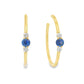 14K Yellow gold hoop earrings, each set with a round blue sapphire flanked by two round diamonds. Item - J39003 - ABC Jewelry Co. 